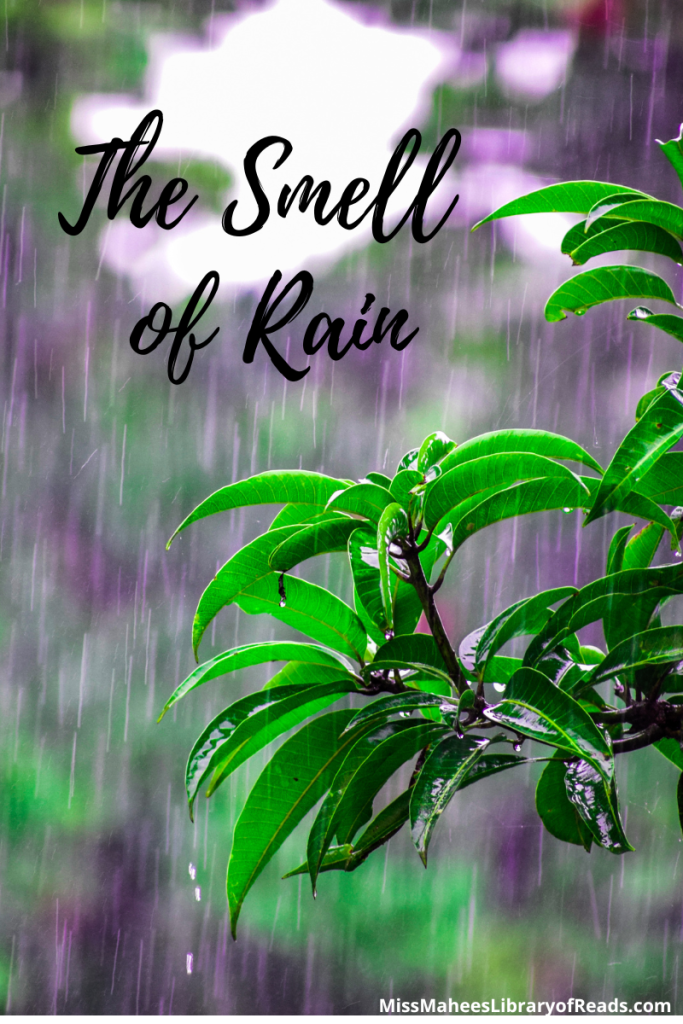 image of small branch with bright green leaves being drenched in rain. black letters across top left reads The Smell of Rain.